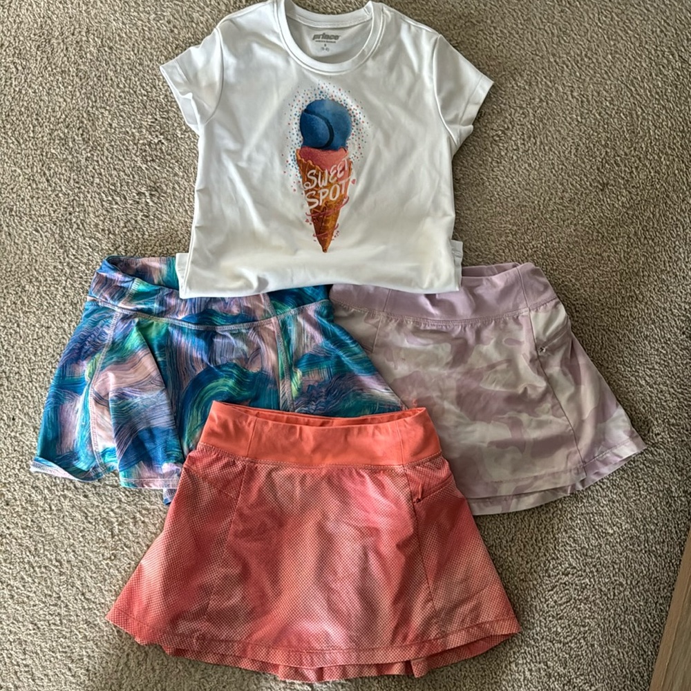 Girls size small tennis lot. 1 Prince Shirt, 3 All in Motion skirts.
